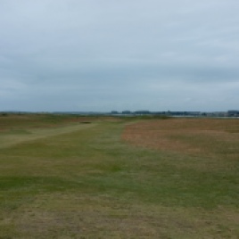 The view of the narrow 5th fairway from just beyond the ridge over which you must drive.