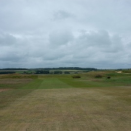 The view from the 12th fairway. The green on this hole is located on top of a low ridge and guarded by a lone bunker to the front right. Interestingly the putting surface is set down slightly making it blind from the fairway.