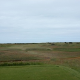 The view from the 13th tee. At just 316 yards, longer hitters will be tempted to take the first fairway bunker on and go for the green, though with two bunkers sited further up guarding the right and a narrowing of the fairway, there is little room for error. A long iron from the tee will take all of the danger out of play and may well be the better option here at this short, uphill par four.