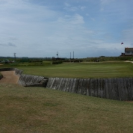 A close up of the huge cross-bunker in front of the 18th green. Note the small timber 'bridge' structure and steps in the centre of the bunker.