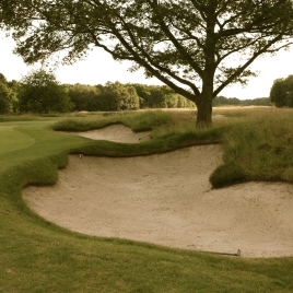 A pair of greenside bunkers guard both sides of the the putting surface at the par four 13th hole. Pictured here are the pair located on the right-hand side. They are just two of fourteen bunkers which can be found on this hole.